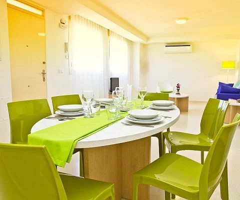 view of the living room and dining room in PV apartments in seville